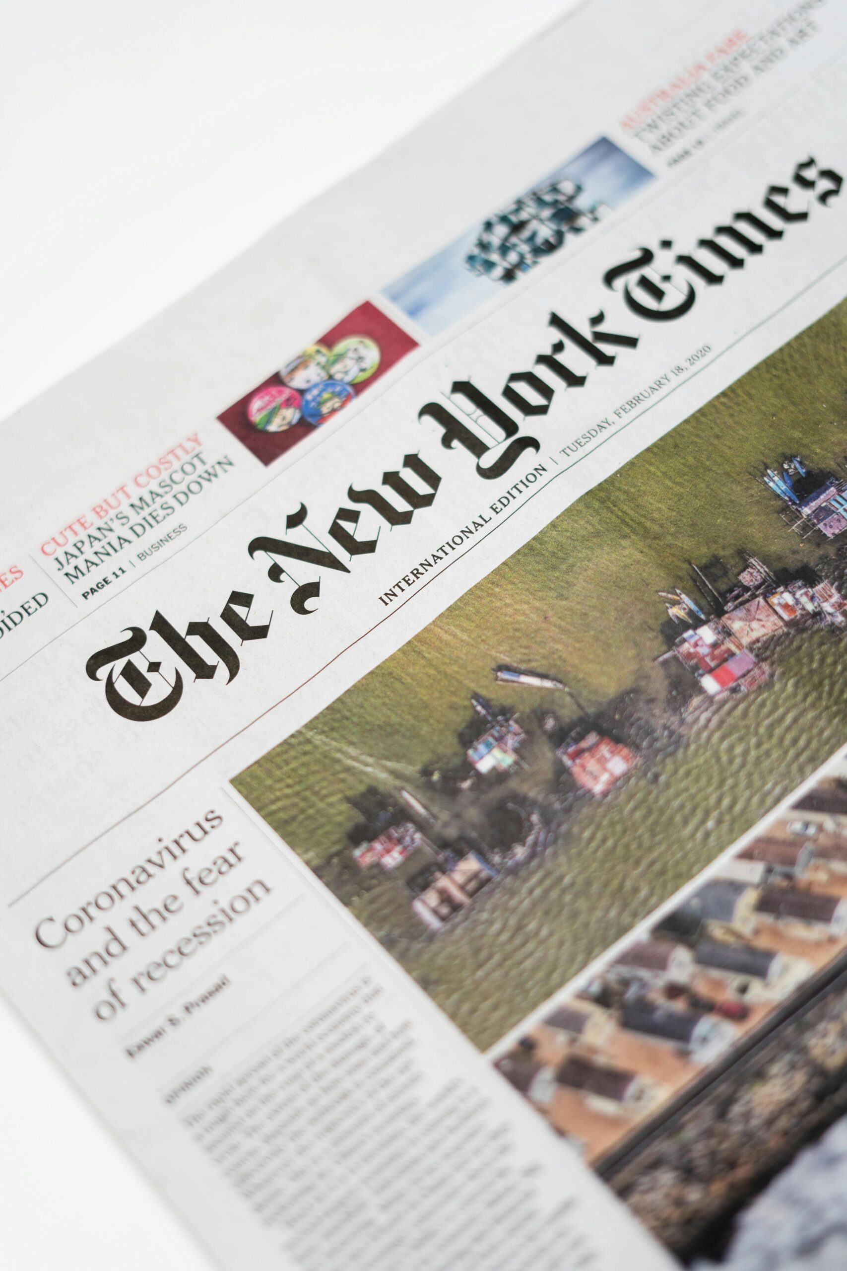 Detailed shot of New York Times newspaper featuring coronavirus and recession headline.
