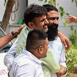 Grieving families outside Sangareddy district hospital after factory fire