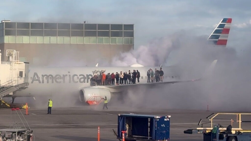 Panic at Denver Airport as American Airlines jet catches fire after landing – American Airlines fire Denver incident captured by eyewitnesses.